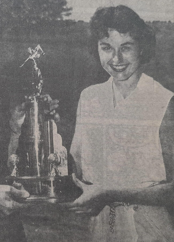Barbara with the state championship trophy